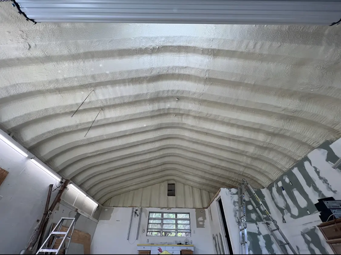 Spray polyurethane foam applied to the underside of a metal roof deck in Maryland Heights